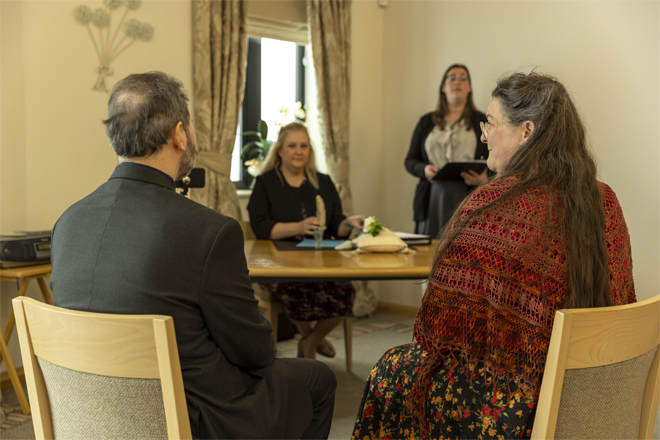 Image of a couple getting married.