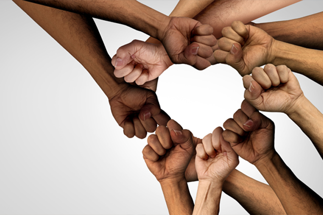 Image of hands forming a heart.