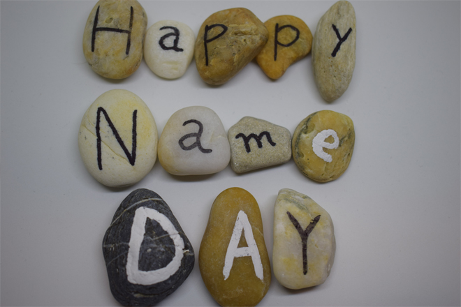 Image of stones with letters on. - Happy name day.
