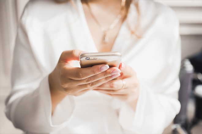 Image of a woman on her phone.