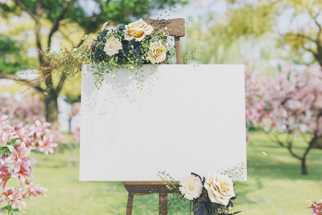 Image of a wedding board and flowers.