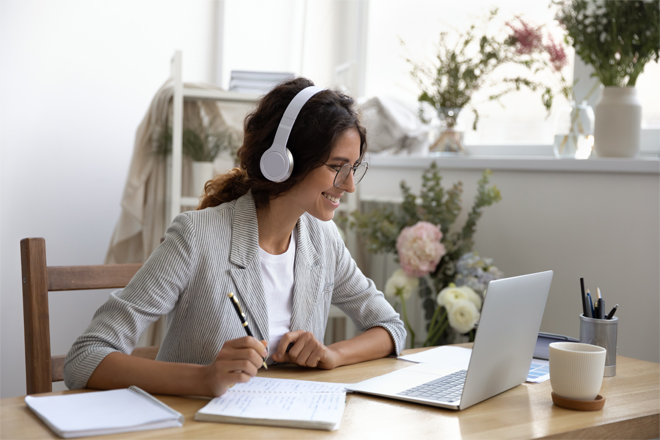 Image of a lady working on her laptop.